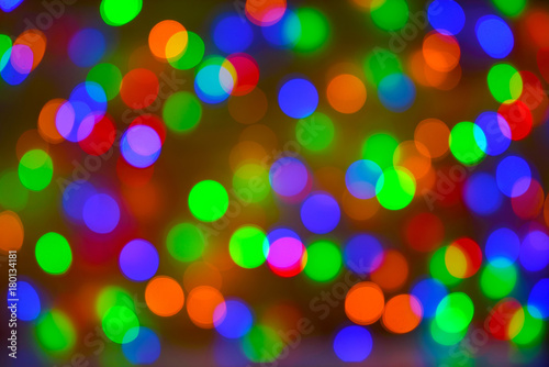 Christmas bokeh background, copy space. Defocused new year bokeh lights, free space. Blurred bokeh. Abstract holiday glitter background. Lens flare pattern