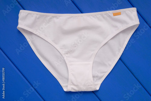 Konstfotografi cotton female underwear is on blue background