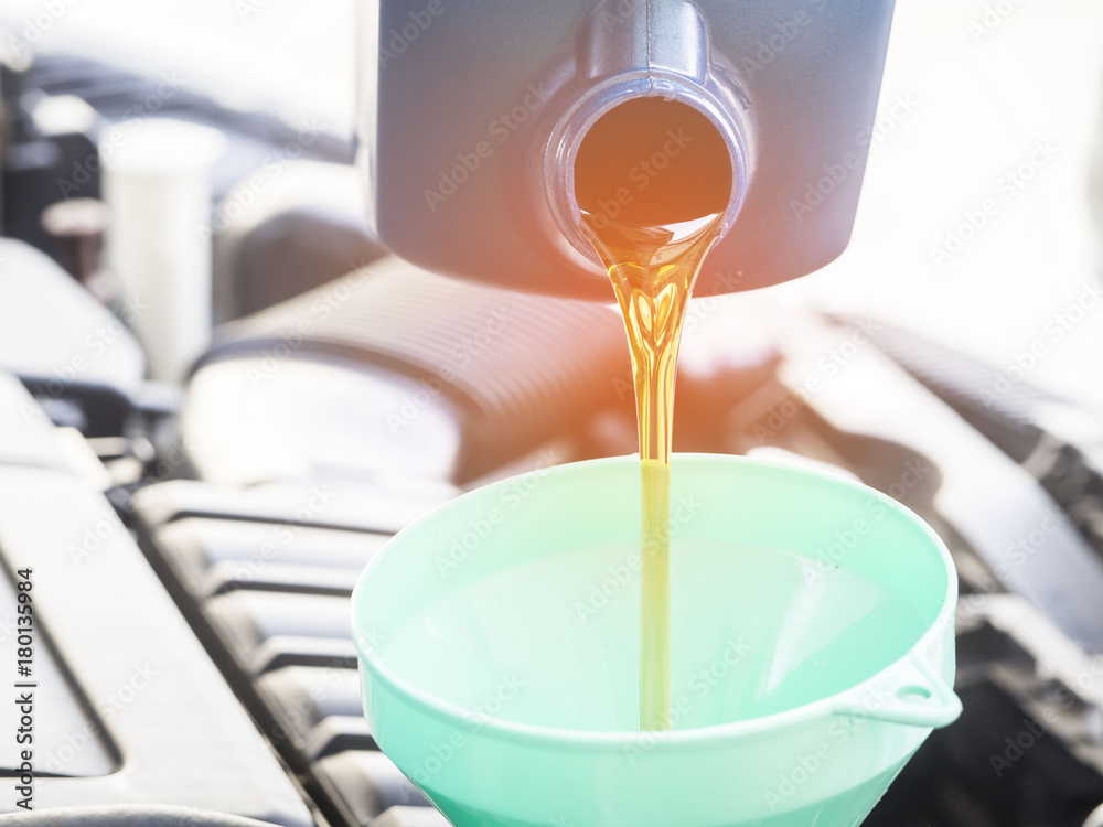 Mechanic change engine oil to preserve engine life,  maintenance concept