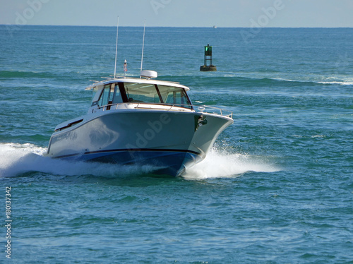 Fishing boat returning to port entering Government Cut in Miami photo