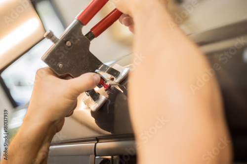 Repairing dents in a car