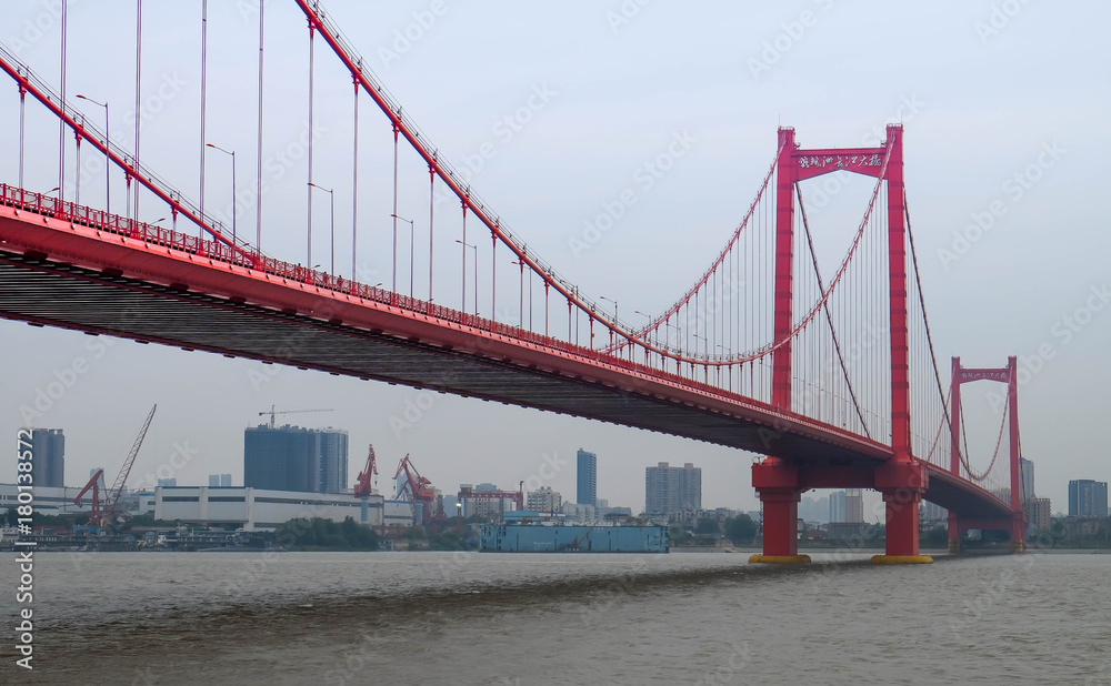 Obraz premium The red bridge across the Yantze river at WUHAN HUBEI, CHINA.