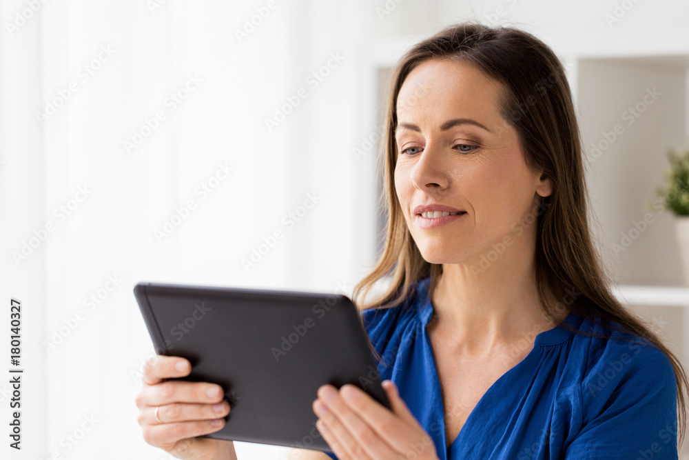 woman with tablet pc working at home or office woman with tablet pc working at home or office