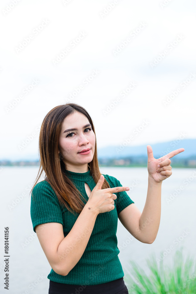 Beautiful asian girl make hand for take photo outdoor Beautiful asian girl make hand for take photo outdoor