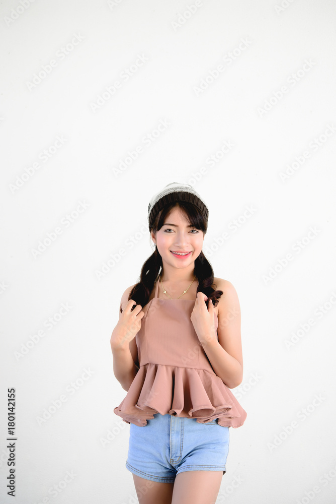 Portrait of hipster girl on white wall,lifestyle of modern teen Portrait of hipster girl on white wall,lifestyle of modern teen