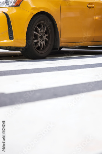 Abstract blur of urban street scene with a yellow taxi cab in New York