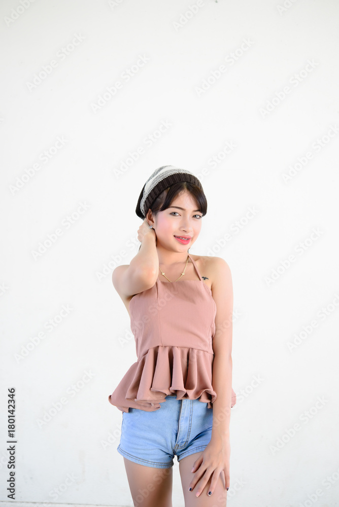 Portrait of hipster girl on white wall,lifestyle of modern teen Portrait of hipster girl on white wall,lifestyle of modern teen