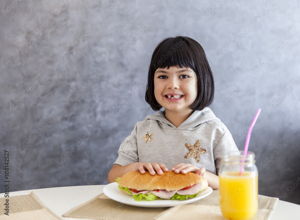 Portrait of little girl having breakfast at home Portrait of little girl having breakfast at home