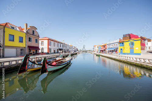 View on the water channel with boats and colorful old buildings in Aveiro city in Portugal