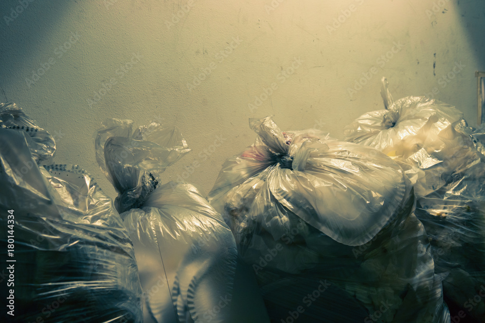 garbage bags with copy space, mixed waste (dramatic dark tone effect)