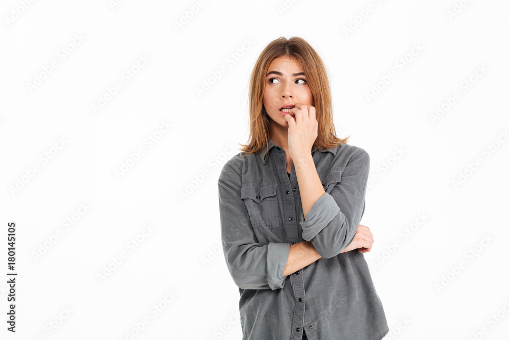 Portrait of a doubtful girl looking away at copy space Portrait of a doubtful girl looking away at copy space