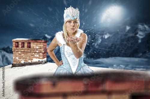 Christmas elf. Roof with chimney. Mountain view with snow and moon. December night. Christmas Eve.