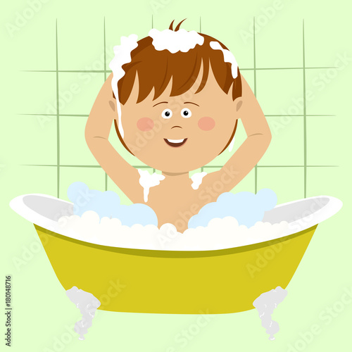 Smiling beautiful baby boy bathing in bathtub with shower at home