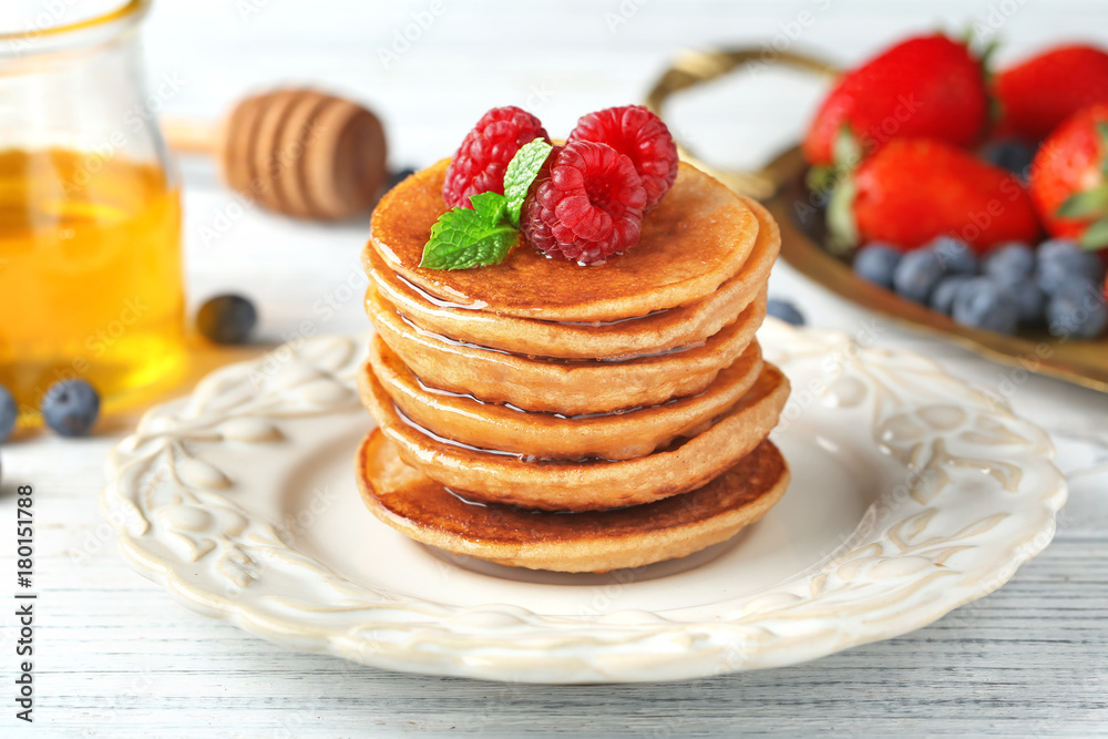 Plate with tasty buckwheat pancakes on table Plate with tasty buckwheat pancakes on table