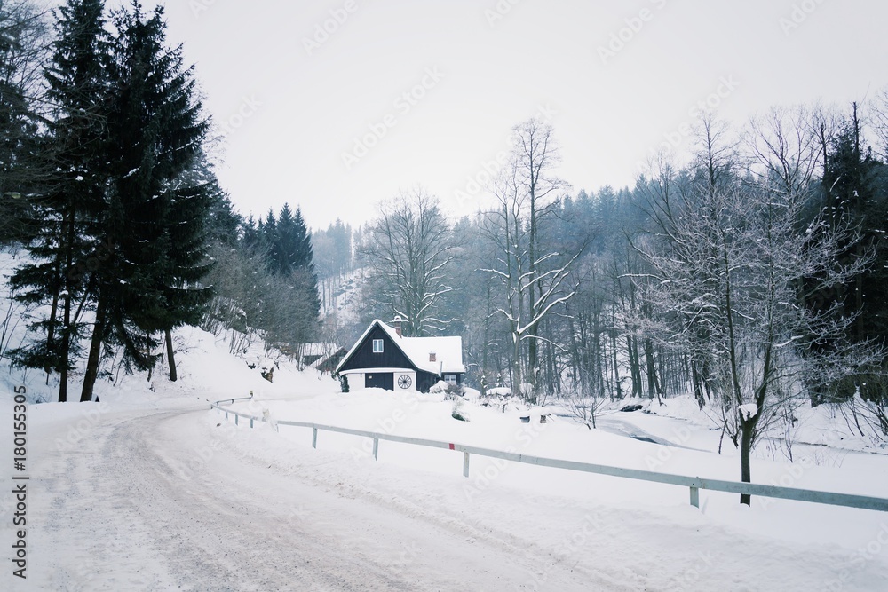 Challet in snowy mountains country, foggy winter day, Czech republic Challet in snowy mountains country, foggy winter day, Czech republic