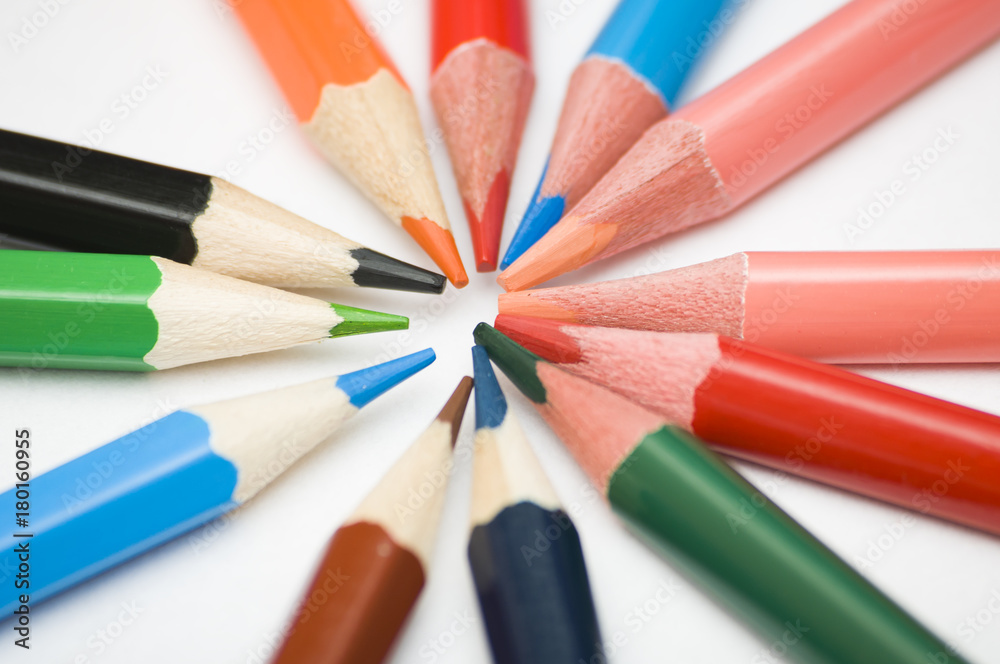 Naklejka premium many multicolored pencils on white background