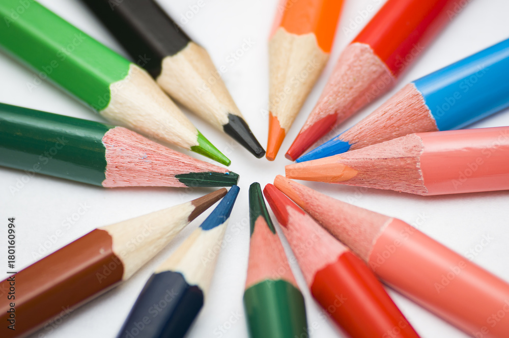many multicolored pencils on white background many multicolored pencils on white background