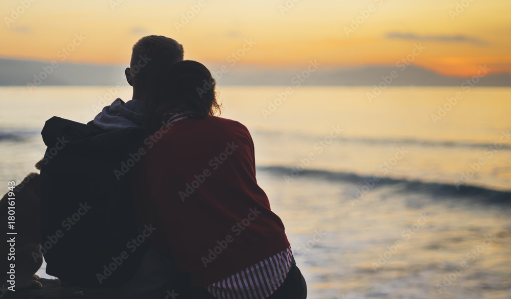 Couple hugging on background beach ocean sunrise, silhouette two romantic people cuddling and looking on rear view evening seascape, hipster with dog enjoy sunset together, travel Couple hugging on background beach ocean sunrise, silhouette two romantic people cuddling and looking on rear view evening seascape, hipster with dog enjoy sunset together, travel