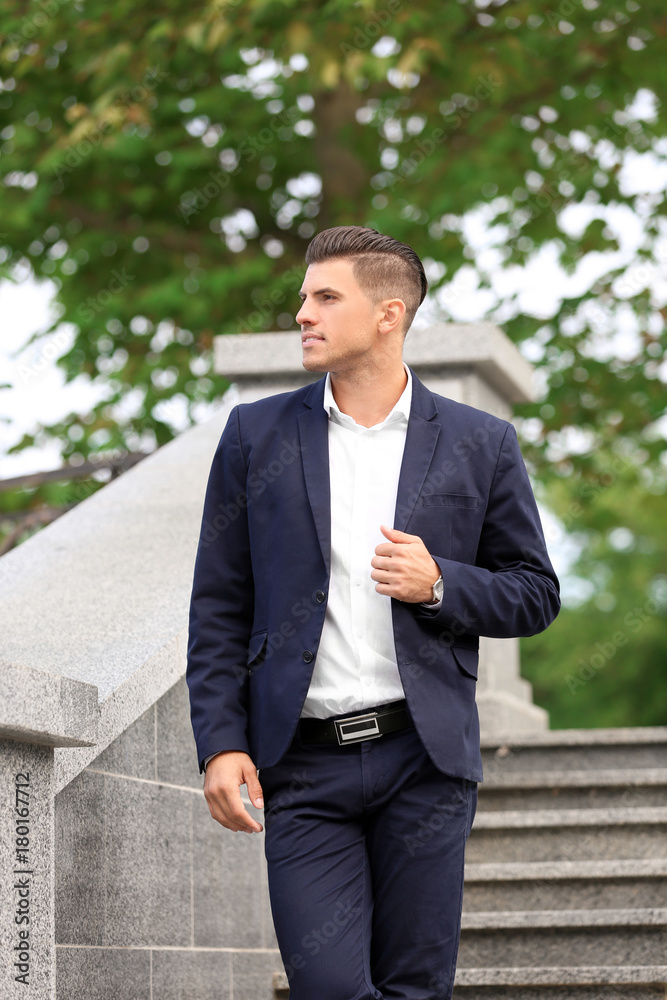 Attractive man in formal suit on city street Attractive man in formal suit on city street