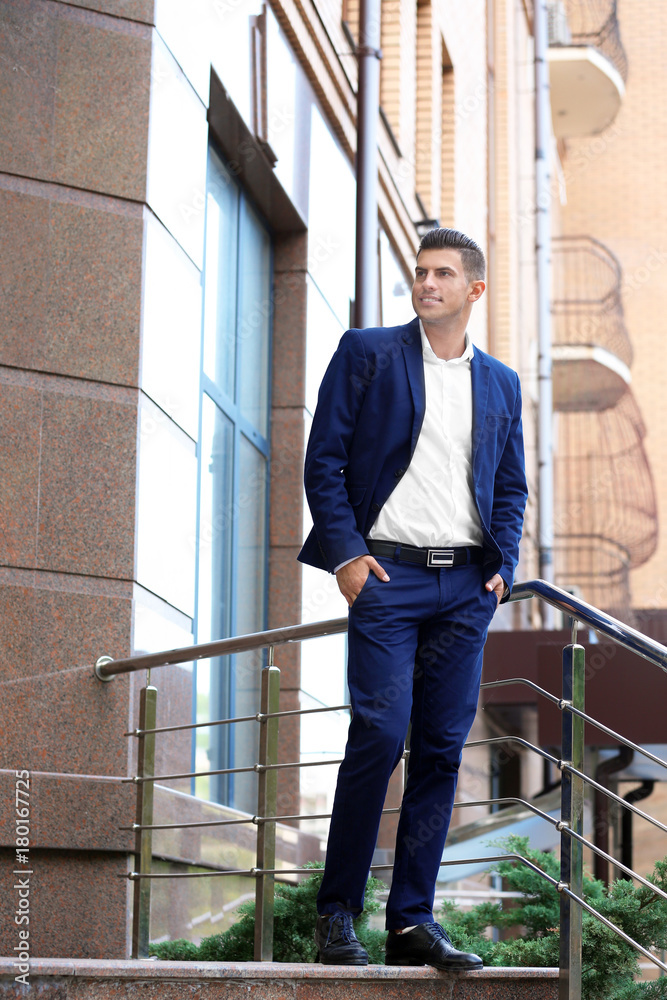 Attractive man in formal suit on city street