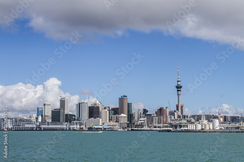 view of Auckland CBD, city center, with sky tower from under the bridge, new zealand