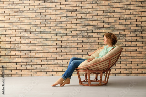 Young woman resting in loun...