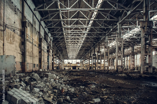 Large empty abandoned warehouse building or factory workshop © DedMityay