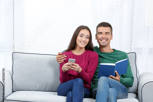 Young couple on sofa at home