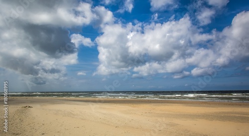 Dutch beach on a clear day with some clouds © Mathieu