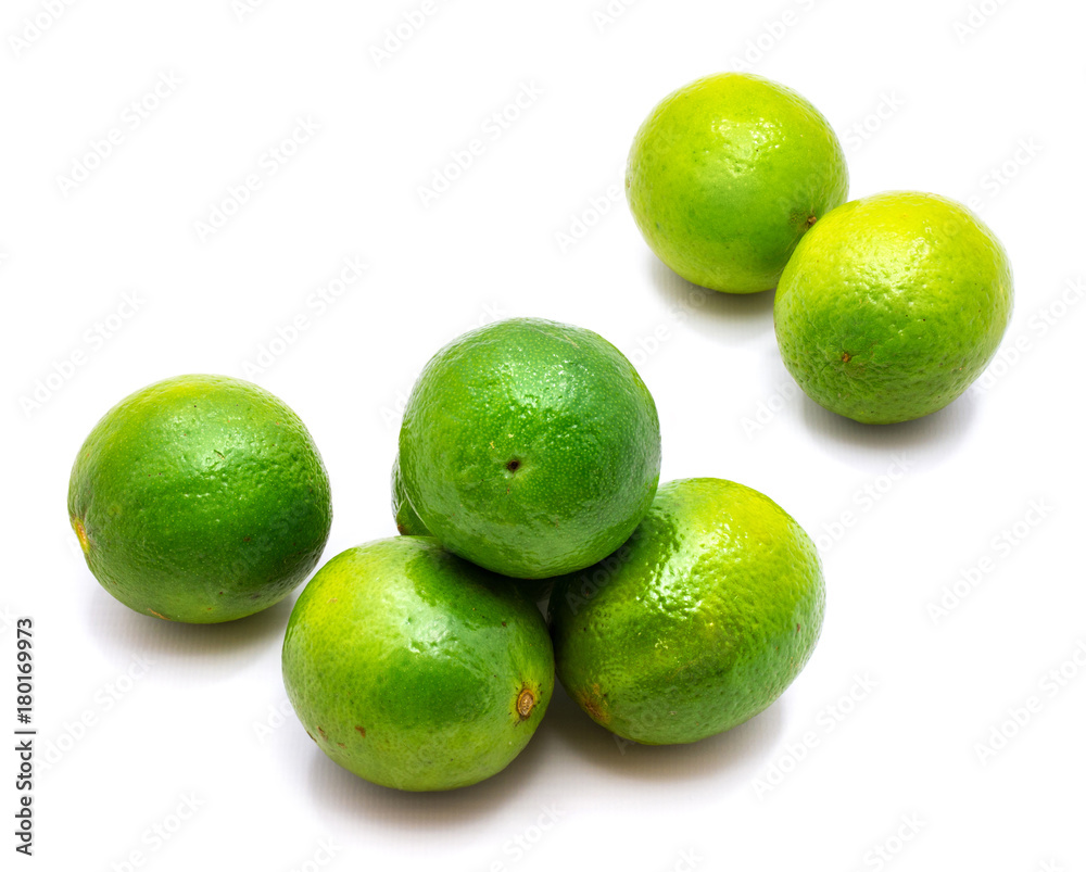 Group of whole green lime isolated on white background. Group of whole green lime isolated on white background.