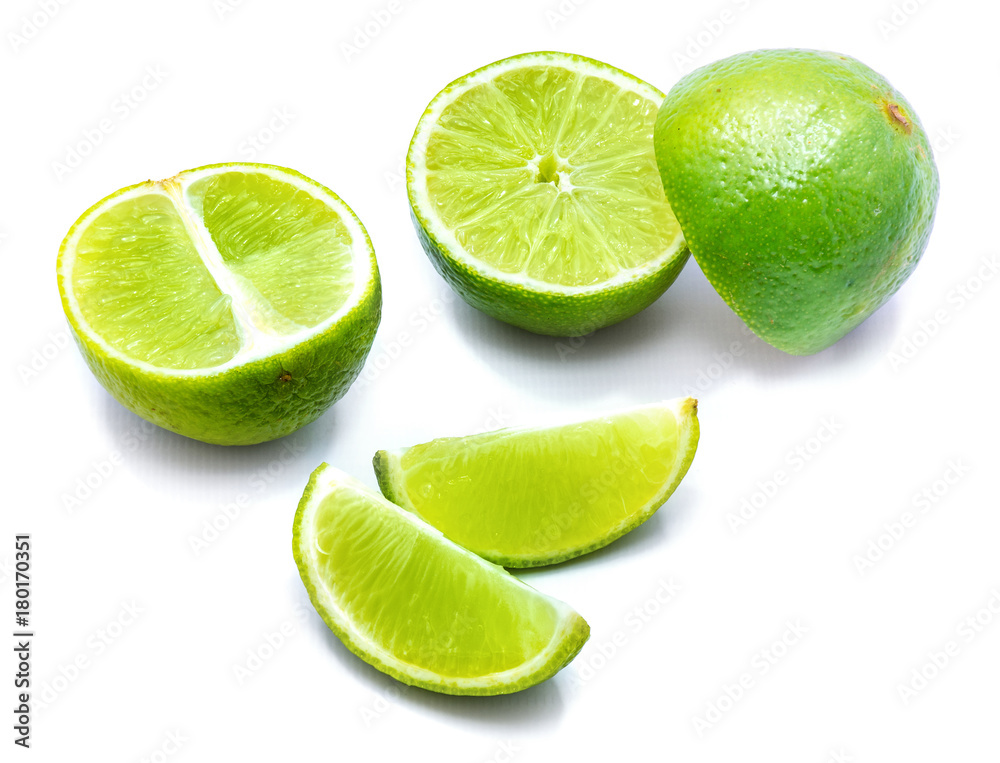 Lots of halves and lime slices isolated on white background.