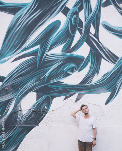 graffiti with fishes and a boy in Rome