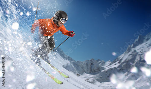 Winter Sport. Skier in mountains.