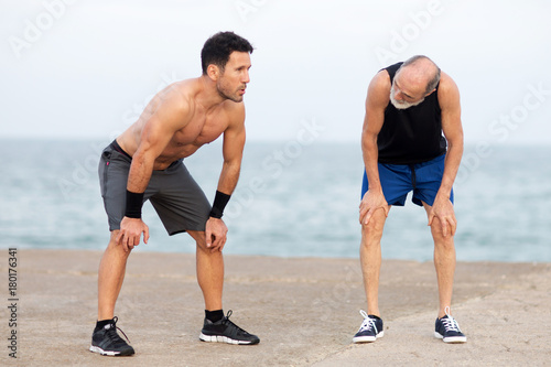 Two men tired after workout exercise 