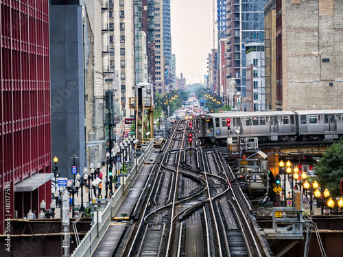 Elevated Train Tracks above the streets and between buildings at The Loop August 3rd, 2017 - Chicago, Illinois, USA photo