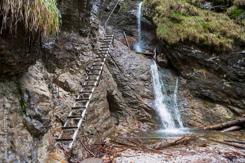 Waterfall and metal ladders in Slovak Paradise National Park photo