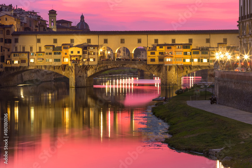 River Arno and famous bridge Ponte Vecchio at gorgeous sunset in Florence, Tuscany, Italy