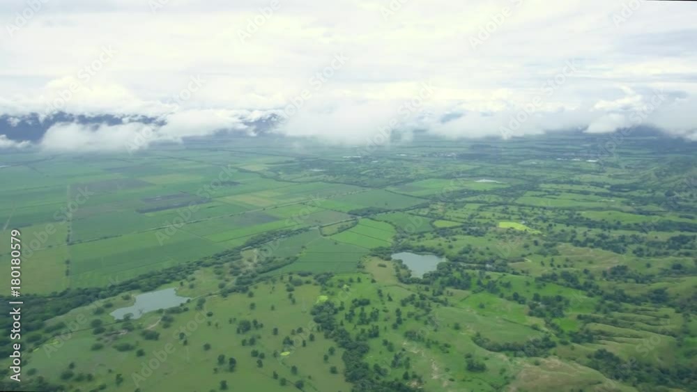 Aerial pan of mountains and greenery in valley in Colombia Aerial pan of mountains and greenery in valley in Colombia
