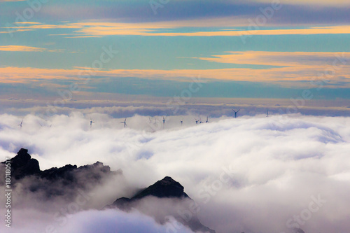 Wind Mills apearing out of clouds