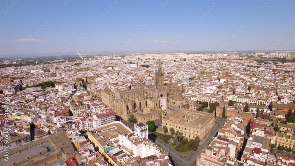 Seville city aerial view including the famous Cathedral and Giralda Tower in Sevilla, Andalusia, Spain. Seville city aerial view including the famous Cathedral and Giralda Tower in Sevilla, Andalusia, Spain.
