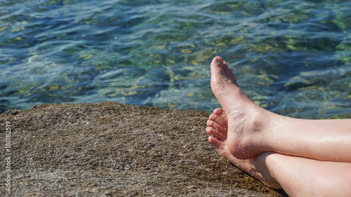 Foot with sea water in background