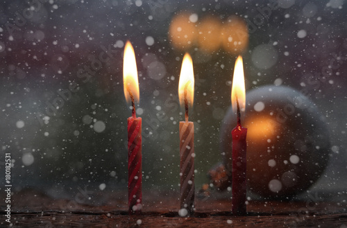 Burning candles, snow