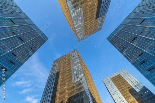 Modern office buildings against blue sky.