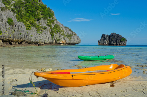 beach and sea with Kayak boat. beautiful beach and sea with mountain background. Clear sea. Summer time. Relax on holidays. Travel