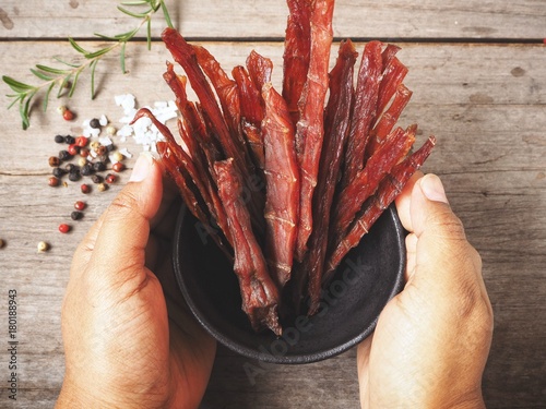 Fotografía Beef jerky on hands