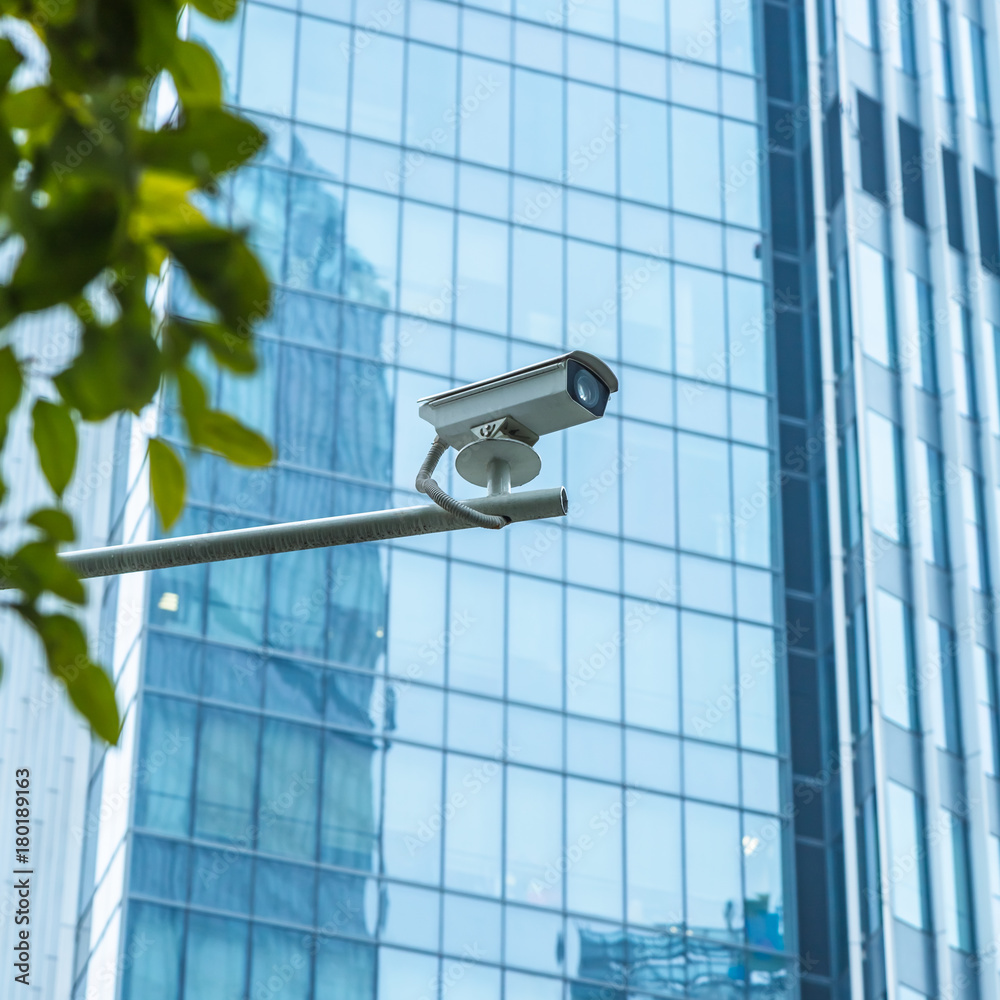 close-up view of security camera, in front of office building.. close-up view of security camera, in front of office building..