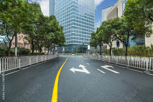 city road through modern buildings in beijing.