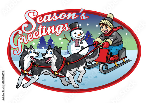 boy riding the sleigh with his huskies dogs