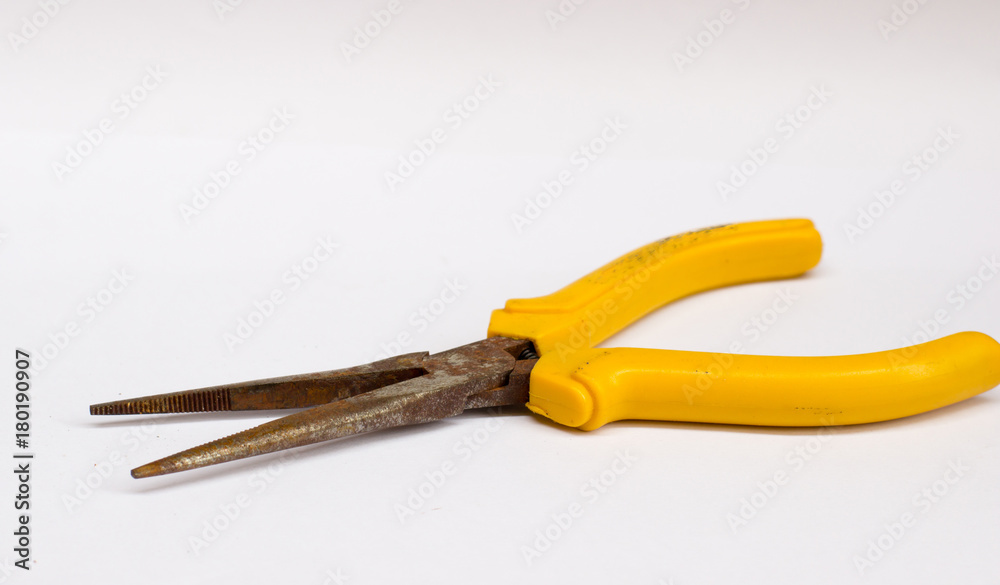 Obraz premium the pliers on the wooden floor with copy space on white background isolate
