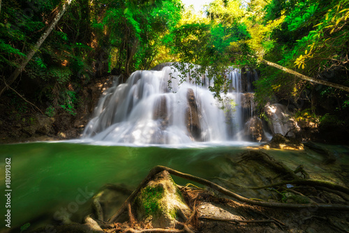 Huay Mae Kamin Waterfall in deep rain forest jungle in Kanchanaburi Province Thailand, beautiful waterfall in autumn forest